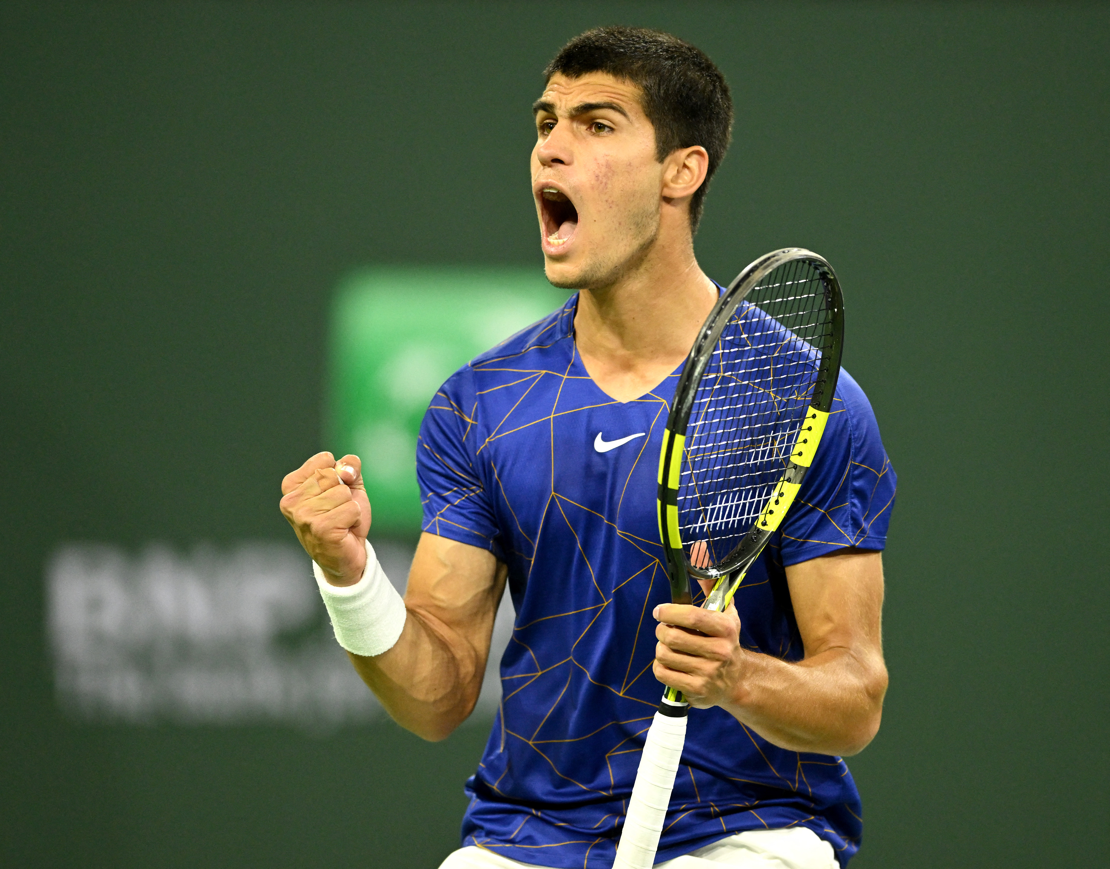 Mar 17, 2022; Indian Wells, CA, USA;  Carlos Alcaraz (ESP) celebrates in his quarterfinal match defeating Cameron Norrie (GBR) at the BNP Paribas Open at the Indian Wells Tennis Garden. Mandatory Credit: Jayne Kamin-Oncea-USA TODAY Sports